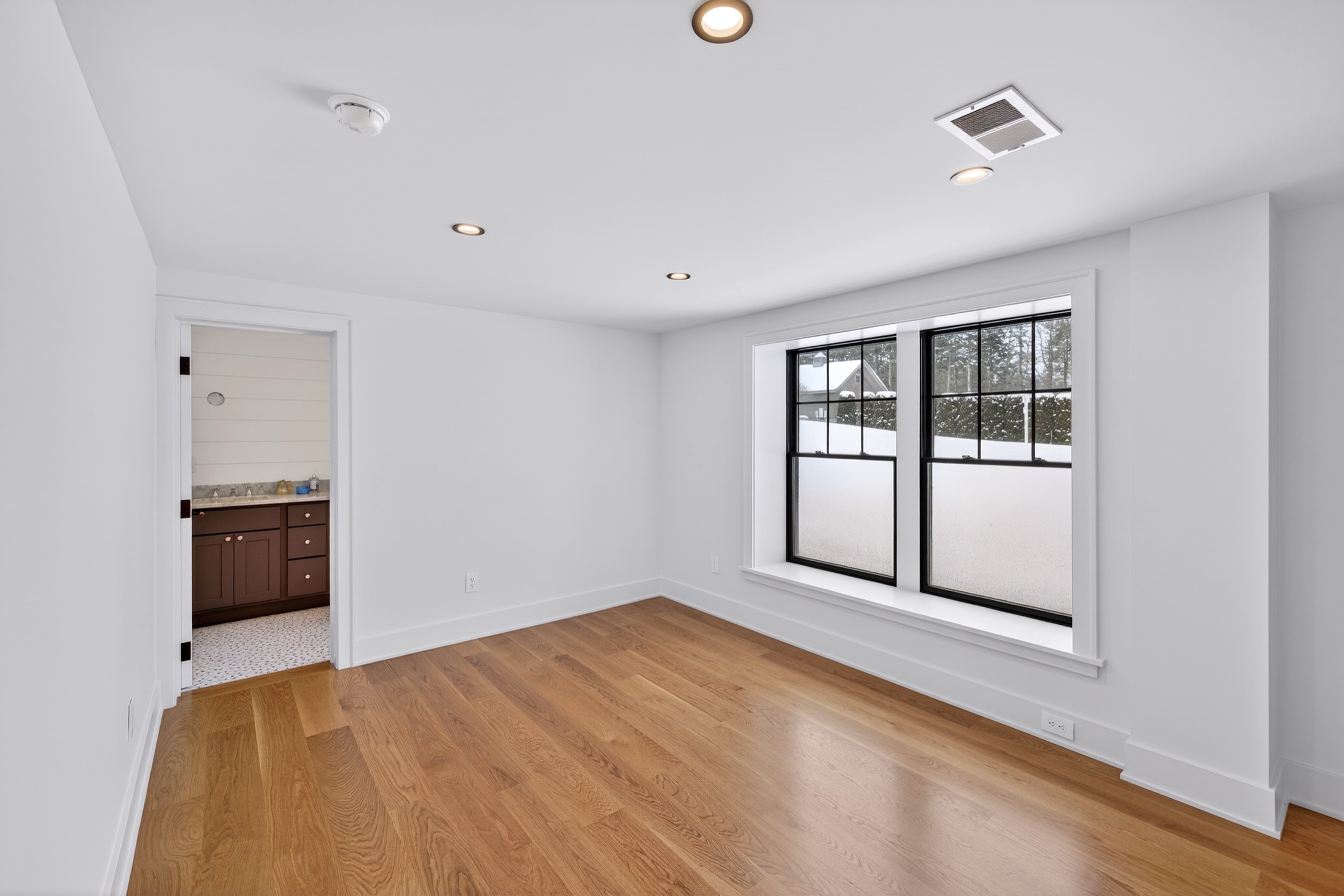 Syracuse virtually staged home — living space with warm neutrals